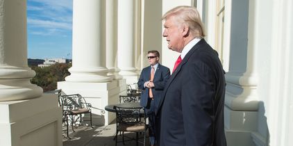 US President-elect Donald Trump walks onto a balcony at the US Capitol in Washington, DC, on November 10, 2016. / AFP PHOTO / NICHOLAS KAMM