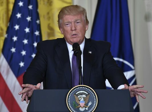 NICHOLAS KAMM / AFP Le président américain à Washington, mercredi 12 avril.