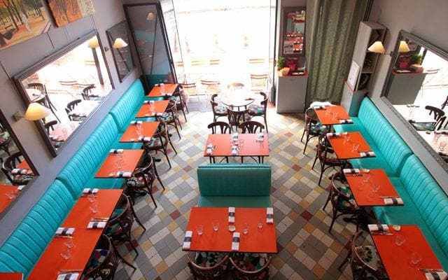 Au Rendez-vous des Camionneurs has colourful banquettes and a few seats outside