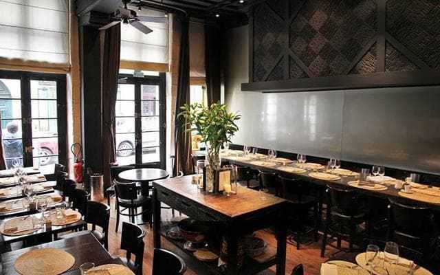 The high-ceilinged, 17th-century dining room has been stylishly updated