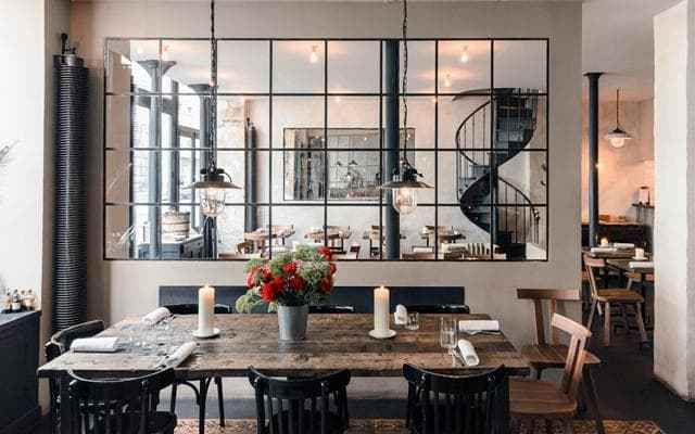 The look here is distressed bistro casual and industrial lighting