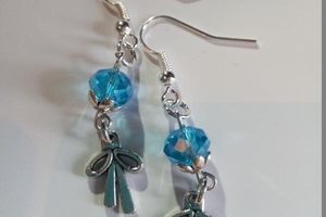 ** boucles d'oreilles argentées, perle et noeud **