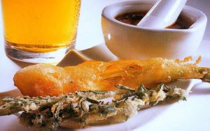 Tempura de cebolleta con salsa romescu