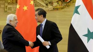 Le ministre des Affaires étrangère syrien Moualem et son homologue chinois Wang