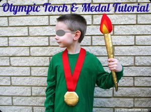 La torche et médaille olympique
