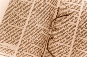 Open bible with glasses