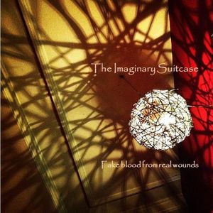 Album - “Fake blood from real wounds" THE IMAGINARY SUITCASE