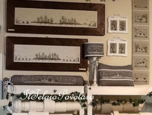 Un piccolo angolino del nostro stand dove svettano i tre paesaggi di Renato Paolin