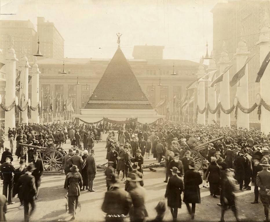 A towering pyramid of 12,000 German helmets in front of Grand Central Terminal, New York in 1918