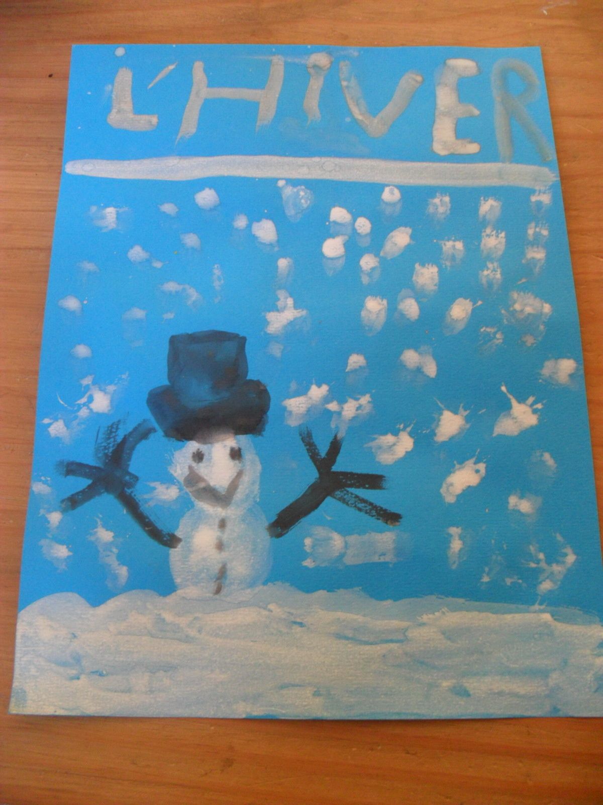 Notre premier lapbook: première de couverture faite par Mathieu avec de la peinture.