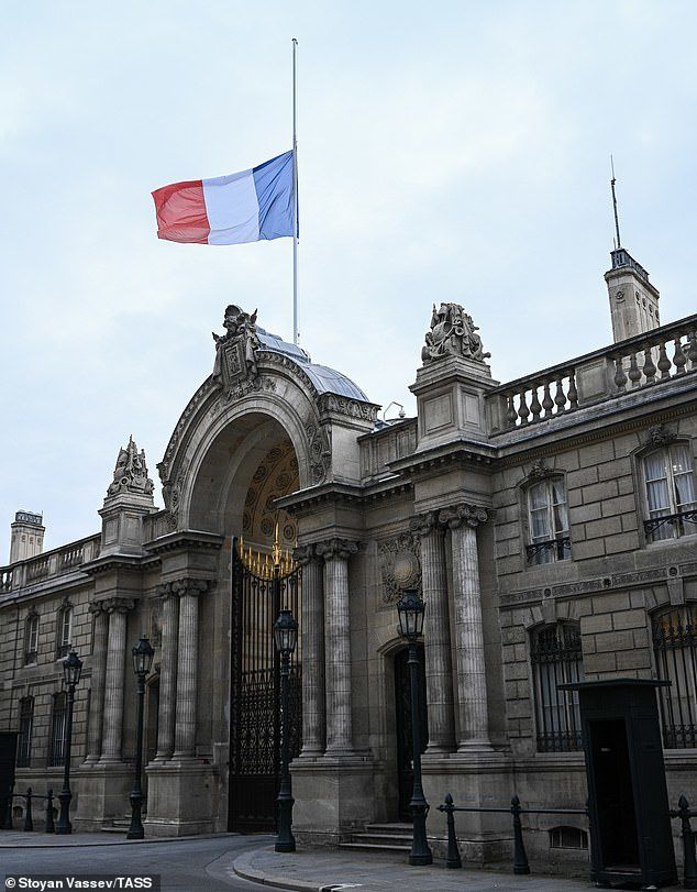 The French national flag flying at half-mast on the Elysee Palace in memory of Jacques Chirac before nightfall in Paris yesterday 