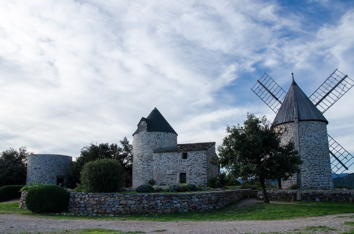 Le lieu dit « Les Trois Tours », connu comme les Moulins de Faugères, se situe au dessus du village de Faugères sur le point culminant de la commune (altitude 417m). Au 12e siècle, sur l'emplacement de la tour centrale, fut construit un 1er moulin, apparemment bâti sur les ruines d'une tour de guet Romaine. Les deux autres moulins datent du 16e siècle. 