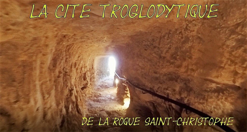 Cette falaise abrupte et sauvage, haute de 80 mètres en à pic de la Vézère, recèle, presque secrètement, à la fois un prodige de la nature et un trésor de la civilisation. Les traces géologiques et les émouvantes empreintes de l’Homme s’entremêlent dans cet endroit exceptionnel classé Monument Historique. Au fur et à mesure de la visite, du paléolithique à la renaissance, en passant par le Moyen Âge, l’espace et le temps ne font qu’un. La cuisine, les lieux de culte, les appareillages ingénieux, toujours en état de marche, tout est magnifiquement reconstitué et expliqué pour faire de ce village troglodytique, un livre ouvert sur 55000 ans de pratiques humaines. Située sur la commune de Peyzac-le-Moustier, proche des vestiges qui donnèrent leur nom à l’époque moustérienne, la Roque-Saint-Christophe est un modèle rare et unique de l’habitat troglodytique et de son évolution. Au bord de la Vézère, ce roc calcaire d’un kilomètre de long et les abris sous roches forgés par le temps ont permis, notamment au Moyen Âge, de bâtir de nombreux logis. Les traces de la vie quotidienne attestent de l’habileté de ses premiers bâtisseurs. Les visites guidées ou accompagnées d’un livret donne une idée précise de ce que fut ce village où l’on imagine, d’échelles en escaliers, le fourmillement de la cité. L’emplacement de l’église et ses sépultures est un des lieux les plus bouleversant de la visite. Durant l’été, la plupart des matinées permettent d’être initié au maniement d’impressionnants engins comme le « Treuil à tambour » par exemple. Mais d’autres surprises, d’autres mystères, d’autres trésors vous attendent dans ce lieu unique, habité depuis 55000 ans par l’âme humaine.