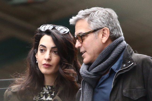 George Clooney is discussing his "sham" marriage and "fake" twins details with Amal