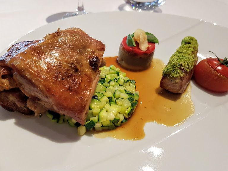 Quartier d'agneau des Pyrennées, la côte poêlée minute, l'épaule confite, bohémienne d'aubergine fumée, tomate au pistou Au Trou Gascon restaurant Paris 12