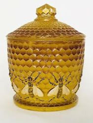 pot marron avec couvercle et abeilles